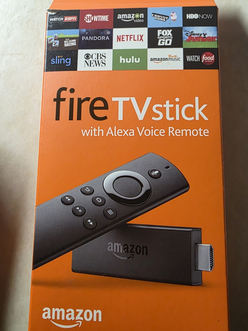 Amazon Fire TV Stick with Alexa Voice Remote - Black and Orange Packaging